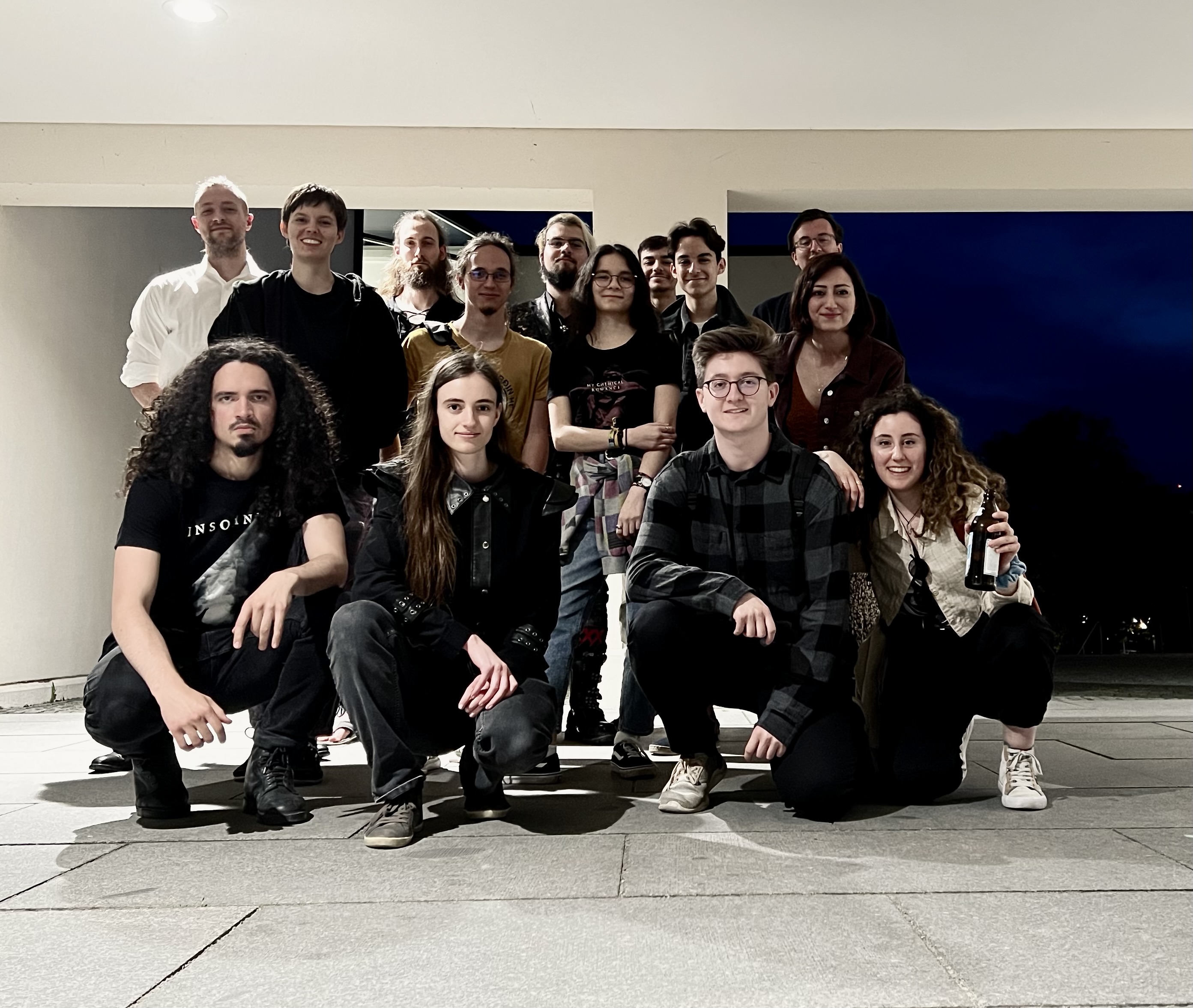 group photo of bleak sanctuary band members among 10 friends and fans