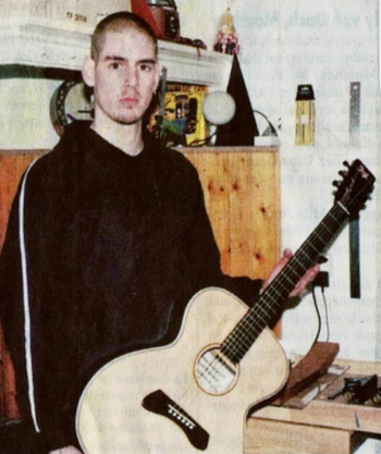 Holding my first guitar build - 1997
