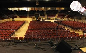 The calm before the storm. The empty arena before the concert
