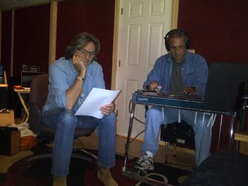 Harry Stinson and Gary Carter working out a steel part in the recording studio
