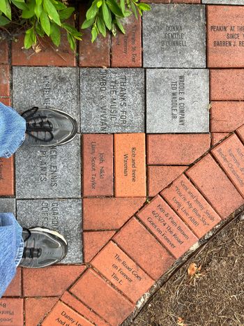 Rob and Irene's brick with other bricks at walkway of Big House Museum

