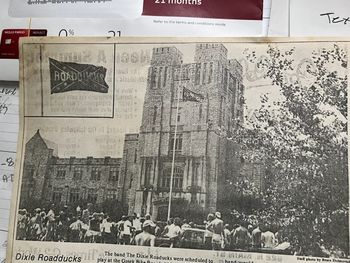 The Roadducks played VA Tech in 1984. Take a look at what flag is flying from the school's flagpole.
