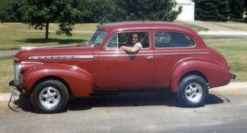 My 1940 Chevrolet. My Dad and I towed it home, I paid $150. Many hours restoring from top to bottom.
