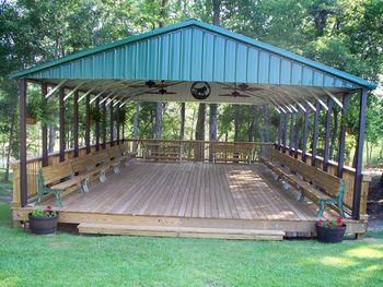 The Pavilion is 24' X 36' and has seating for 50 plus. The back of the benches flips over to make a table. You can see dogs work in the beaver pond from this view point.
