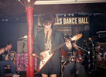 Dingwalls, UK, 1988 Marc soloing while Ned alerts our roadie, Dave ‘Kiwi” Burlace a problem of some sort….. Photo by Steve Power
