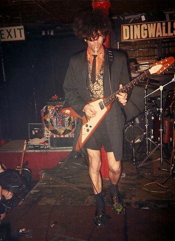 Dingwalls, UK, 1988 Marc’s sense of style was second to none.A formal coat, shorts, and paint -spattered dress
shoes.With a fresh cig, he starts the show on the hottest London night in hundred years. Stick around and watch us melt.  Photos by Steve Power
