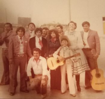 (Mexico) Exposition artists pose for backstage photo. Notable Names: Eva Ybarra (Center), Pedrito Fernández (Guitar), and Mariana De La Cruz (White Dress)
