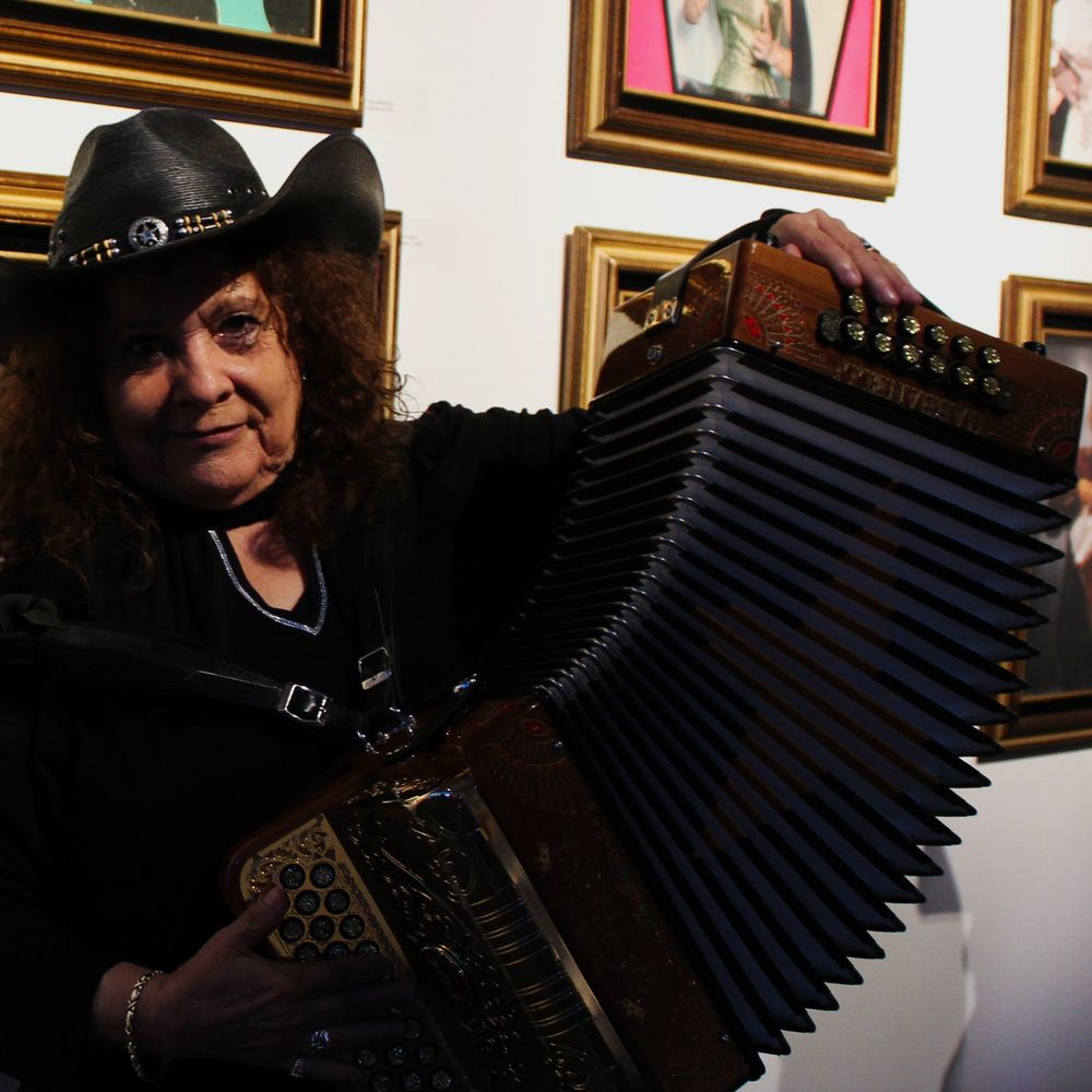 Eva Ybarra posing with her accordion.