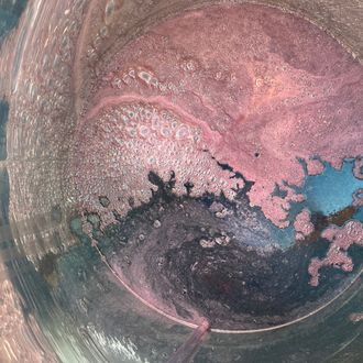 Circular motif of the rosé in the vat