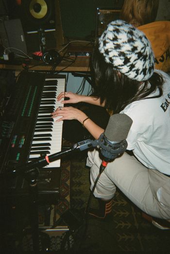 NYC indie songwriter and musician Zoë Fromer playing keyboard on film in Brooklyn, NY music production studio.
