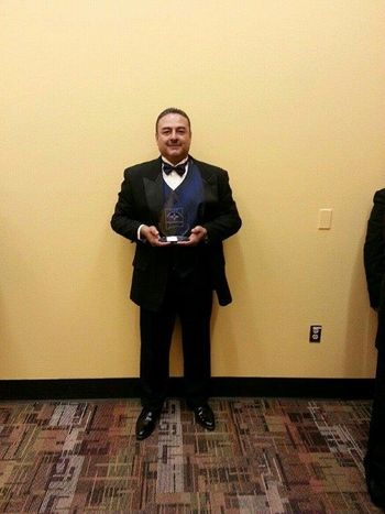 Ruben holding the Black Pearl award for 2014Bilingual Song of The Year
