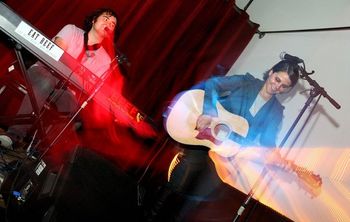 Paige and I performing at Luigi's Fungarden, apparently located in the center of a wormhole... Photo by Addam Goard
