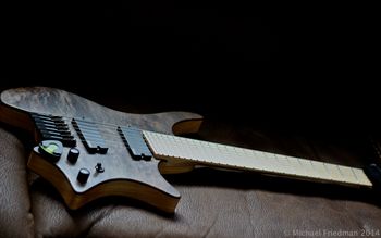 (06/03/14) This is a Strandberg Boden 7 String. I am very excited about this guitar and this company and have been following them for some time. I have only had this guitar for about 2 weeks but I have not been able to put it down. I ordered it about 7 months ago. This is part of the production line, the neck and body are made by the Washburn Custom Shop in Chicago  and then Allan Marcus does the final build, Allan is part of Astral EXR Systems along with Paul De Maio, Both of them have been noting but a pleasure to deal with, truly great guys and I wish other companies would follow there lead. I am also on the wait list for a custom one made by Ola Strandberg in Sweden. Where to start on this guitar is the hard part. I am a such a fan of Parker because I feel like Ken Parker really took all we have learned and tried to make a better guitar for the real player. I have not seen anything like it since until I saw what Strandberg was doing. The body is chambered Swamp Ash with a Carlo Walnut top. The neck is Maple with a Birds Eye Maple fretboard with glow in the dark inlays. It has 24XL Stainless Steel frets. The pickups are EMG 707X and I got to say EMG really did a great job on these. Now on to what makes this truly a special design. The neck is a mixed scale length or fanned fret. It keeps the lower strings feeling tight while keeping the higher strings easy to bend but it always helps keep the natural movement of your hand and makes any two handed tapping stuff so much easier. The back of the neck is a EndurNeck, which has a flat spot to keep your thumb on. I love this neck, it makes moving with the 7 string effortless. The body is cut in such a way that you can hold and play the guitar in many different positions. It is great for practicing on a couch or recording in an office chair and has been great for teaching and writing while holding the guitar. And the best part is the guitar is super light, under 5lbs. This is a great step forward in guitar design and this will not be the last Strandberg I buy. I am super excited to see what they do next. Oh and this guitar sounds amazing, I never thought I would have a 7 string that sounds so amazing even clean.
