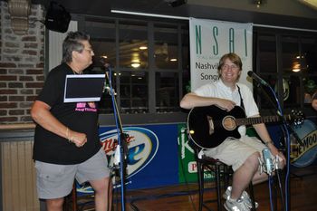 Vicky Lee shares one of her original humor-filled tunes on set with James Davis.
