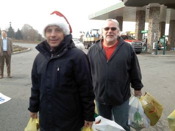 Don and wnnj 103.7 radio DJ Borasio stuffing the bus with food donations.
