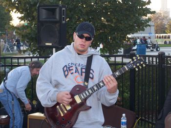 Neil Porter- The guitarist on We Da Bears during a performance at Soldier Field tailgate party
