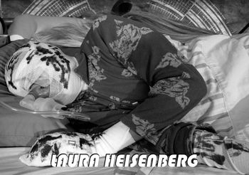 Laura Heisenberg as seen in the "Terminus" video. Laura was Jack Heisenberg's wife. They met at university and they married shortly after they got their PhDs. She was a tall, beautiful woman with red hair and deep green eyes. Well connected with her feelings, she had a powerful sense of intuition. She was friendly and loved by all. Jack and Laura spent their honeymoon in Thailand. When they came back, they got recruited as researchers by Project DNA. Shortly after the discovery of the Technocrat's base under Jerusalem, Laura started suffering from headaches. Within a year, she died of cancer as the rest of the team tried but failed to save her.
