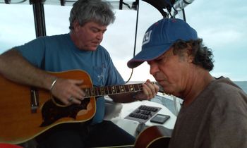 Mike & Paul strumming guitars on the boat 1/11/2015
