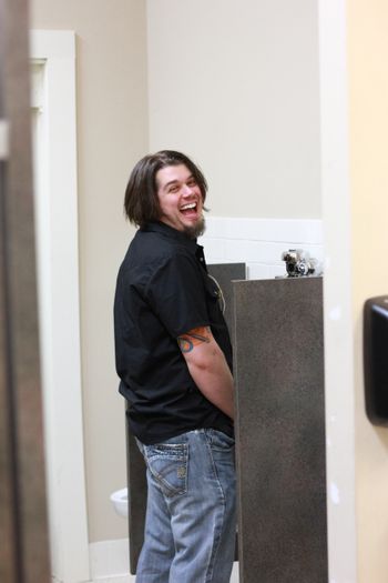 No place is safe from photographer, Brent Fleury! Jason Fricks is snagged in the loo.
