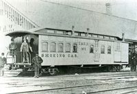 T&N combine smoking, post office and baggage car at the Berkeley St. station. The prominence on the platform is likely Joseph Gould, first reeve of  of Uxbridge Twp., a prominent person of influence. 1872