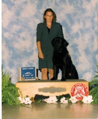 Teresa w/Bowie earning "Highest Scoring Dog"  Bowie AKC CH pointed, JH, WC, CD
