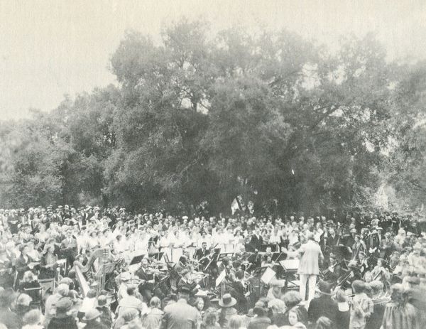 Farwell conducting a community performance in Pasadena, CA (1923)
