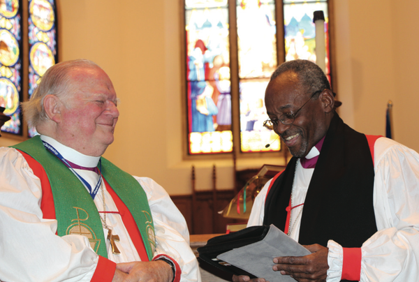 Presiding Bishop Michael Curry awarding Chip the "Bishop's Medal"