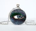 black bird eye pendant on silver