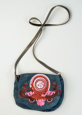 Steampunk Alchemy Timepiece embroidered on denim. The strap is a belt.
