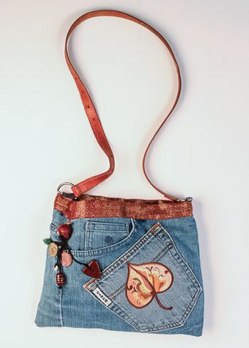 Rosmaled Autumn Leaf embroidered on denim. The strap is a belt
