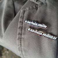 "A Certain Smile, A Certain Sadness" Pins