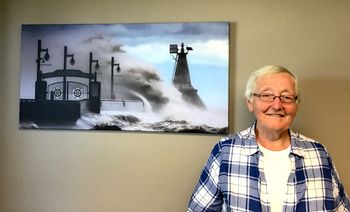 Mayor Sally Martyn in her new office.  She decorated it with the Artwork purchased from Photographer, Micheal Yates at the OTW Art Show!
