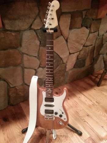 2013: My second guitar was the same as the first, except for that middle pickup. I chose white for church, and got a strap to match. It was ultimately disassembled and sold for parts.
