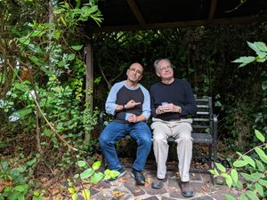 Two Americans in an English garden during a rehearsal break