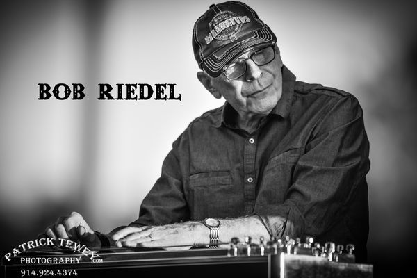 Bob Riedel – Pedal Steel Guitar:
Bob, Jessica’s pedal steel guitarist is not only a musician but also an accomplished singer, actor, and dancer who has performed on radio, television and theater for almost sixty years. Without knowing it you probably have seen or heard Bob on numerous recordings, TV commercials, voiceovers and film appearances. He also appeared on the soap opera “Another World” and won leading roles in musical theater. Bringing many artistic elements to his music Bob has been a major contributor to the Jessica Lynn sound.  
