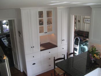 Maple kitchen in white 5 glass doors
