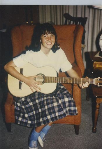 Here she goes!  Suzie and her first guitar 1963,  13th bday Little did she know HOW LONG her road in music will be!
