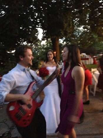 Playing bass and dancing with my wife Cara, before we were married.
