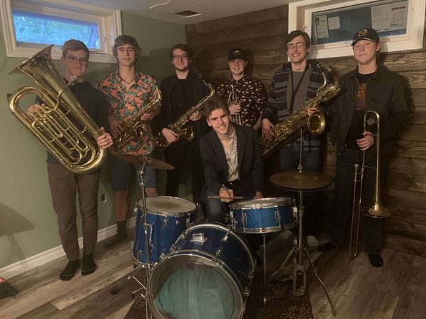 I’d like to officially introduce Backhouse Brass! We are a 7 piece horn band based out of Sydney, Nova Scotia. We play a variety of music from jazz, to funk, to your favourite pop songs, and even some rock classics. You will be able to catch us out busking and playing some tunes at various locations throughout the summer. We’ll keep you updated on this page on where and when we’ll be out in case anyone would like to take a stop by and have a listen! There will also be a “Meet the members” series starting this coming Monday where we’ll introduce a new member everyday and tell you a bit about them, so keep your eyes out for that too! Hope to see you all around soon! 🎶 🎷🎺🥁