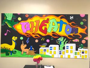 The vibrant mural created by students during Arturo Ho's two-week mural residency at the Pembridge Amherst community center. The mural represents the diversity of the kids and their neighborhood. 