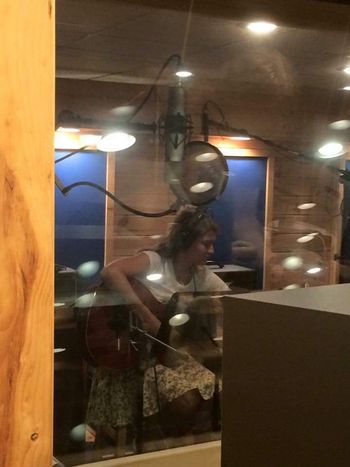 Gena Lucas tracking acoustic guitar and vocals
