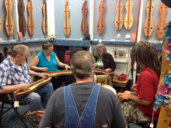 The McSpadden Dulcimer Shoppe in Mountain View, AR Left to right: Jim Woods, owner, Lee Cagle, Joellen, Bing Futch and Duane Porterfield (back to us).
