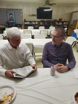 Pastor Lee and Curtis discussing scripture.