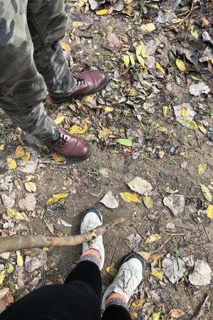 Photo of Abbye and Nathan's feet and hiking stick