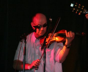 Playing at a gig in July 2011
