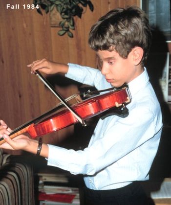 Playing the violin as a young boy

