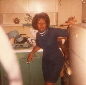 Grandmom leaning on the fridge.. She was always posing..
