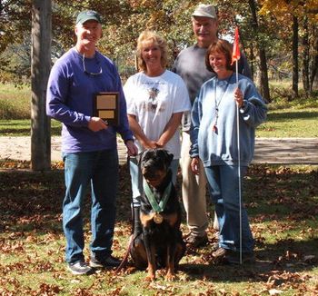 Phantom Wood Indian River with a very happy owner, Brad Pinter, and tracklayer and Judges Donna Wielert and Pam German after earning his TD at the Medallion Rottweiler Club TD/TDX test on October 8, 2006.
