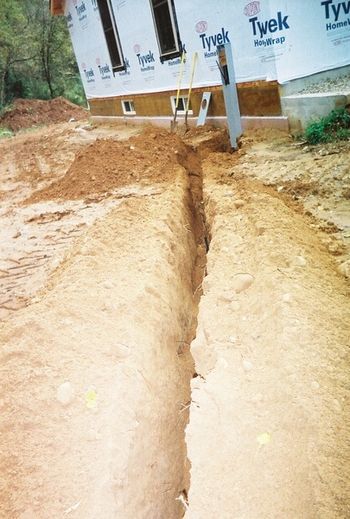 the trench dug up to the house and electric box
