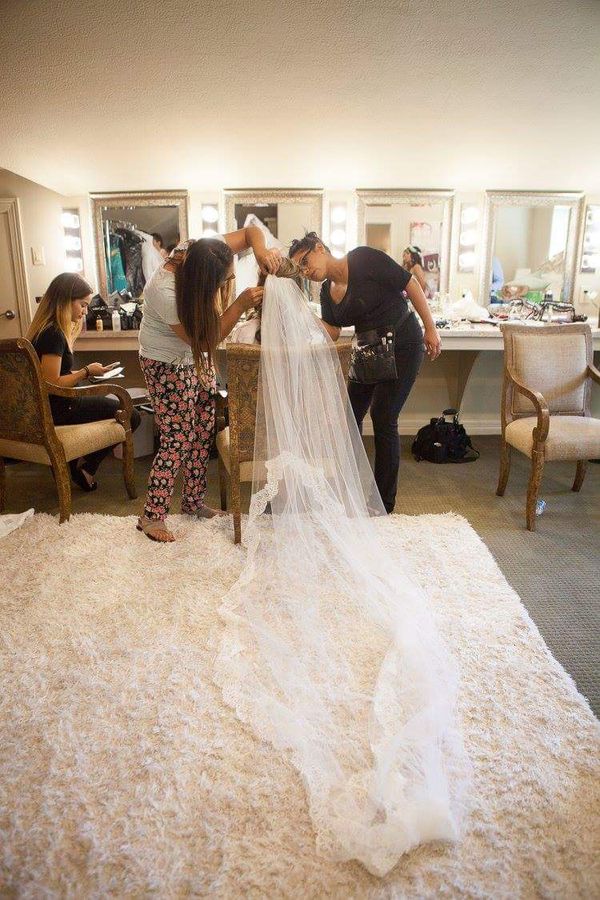 Elizabeth Holbrook with GlamTeamUSA putting finishing touches on Bride Marie-Claire.